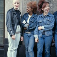 Three teenage girls wearing post punk fashions, 1980.