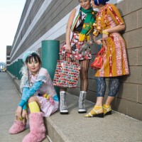 three women on sidewalk - fashion stock pictures, royalty-free photos & images