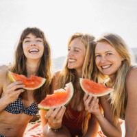 three women on the beach - food stock pictures, royalty-free photos & images