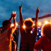 three young friends at music concert - concert stock pictures, royalty-free photos & images