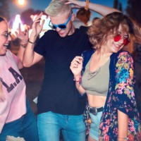 three young friends dancing at outdoor music festival - concert stock pictures, royalty-free photos & images