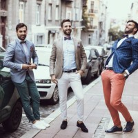 three young good looking tailors laughing on the street - fashion stock pictures, royalty-free photos & images