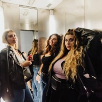 three young women in elevator - fashion stock pictures, royalty-free photos & images
