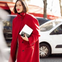 Tiffany Hsu wears white tights, white micro shorts, red coat outside Givenchy fashion show during the Womenswear Fall/Winter 2025/2026 as part of...