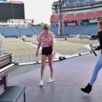 Tim McGraw, Taylor Swift and Faith Hill take photos during rehearsal onstage before the reputation Stadium Tour at Nissan Stadium on August 25, 2018...