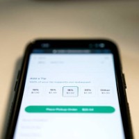 Tip options for take-out food are displayed on a phone screen in Washington, DC, on March 17, 2023. - To tip, or not to tip? That is the question...