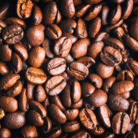 toasted coffee beans background - coffee stock pictures, royalty-free photos & images