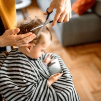 toddler girl getting her first haircut - hairstyle stock pictures, royalty-free photos & images