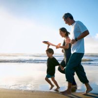 toddler running on beach with toy airplane - travel stock pictures, royalty-free photos & images