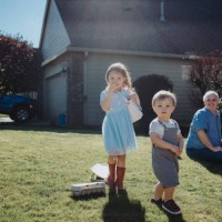 toddler siblings begin an easter egg hunt outside their home - garden decoration stock pictures, royalty-free photos & images