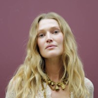 Toni Garrn poses backstage prior to the Zimmermann Womenswear Fall/Winter 2025-2026 show as part of Paris Fashion Week at Le Petit Palais on March...