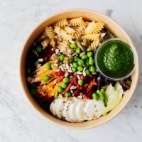 top view of healthy lunch bowl in reusable box. food bowl with chicken, pasta fusilli, mix greens, green peas, sun-dried tomatoes, beet, egg, sunflower seeds and pesto sauce - junk food stock pictures, royalty-free photos & i