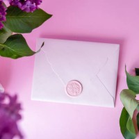 top view of pink envelope with wzx seal,purple lilac above.stock photo. - garden decoration stock pictures, royalty-free photos & images