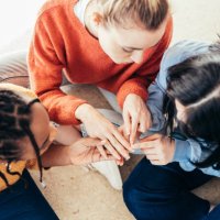 top view of three friends sitting on the floor. - nails art stock pictures, royalty-free photos & images