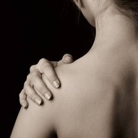 topless woman holding onto shoulder - nails art stock pictures, royalty-free photos & images