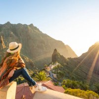 tourist admiring masca village at sunset. masca, tenerife, canary islands - travel stock pictures, royalty-free photos & images