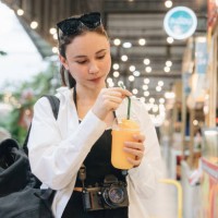 tourist enjoying eating at street food - junk food stock pictures, royalty-free photos & images