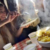 tourist enjoying traditional swiss meal alplermagronen - food stock pictures, royalty-free photos & images
