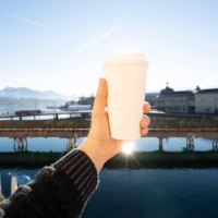 tourist holding a coffee paper cup in lucerne, switzerland - junk food stock pictures, royalty-free photos & images