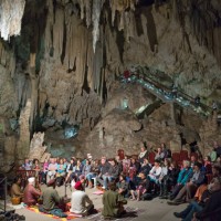 tourists listening to concert in amphitheatre-like chamber in spanish