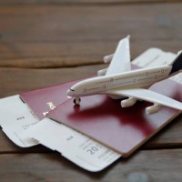 toy airplane with passports and flight booking ticket. travel concept. - travel stock pictures, royalty-free photos & images