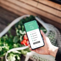 tracking online food and grocery delivery via mobile app on smart phone - food stock pictures, royalty-free photos & images