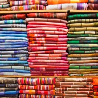 traditional moroccan cloth in a souk in marrakech, morocco, north africa. - fashion stock pictures, royalty-free photos & images