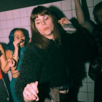 transgender woman dancing against friends at nightclub - concert stock pictures, royalty-free photos & images