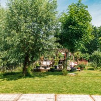 trendy boho garden in the netherlands with a patio and lounge chairs. - garden decoration stock pictures, royalty-free photos & images