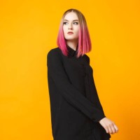 trendy female posing on orange - fashion stock pictures, royalty-free photos & images