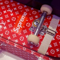 Trunk and a skateboard for Louis Vuitton and Supreme are displayed during 