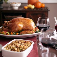 turkey, stuffing, and cranberry dishes on table. - food photos et images de collection