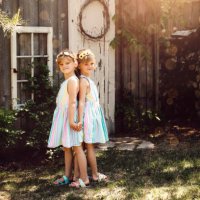 twin girls in garden - garden decoration stock pictures, royalty-free photos & images