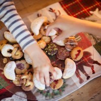 two children choosing traditional german christmas cookies - junk food stock pictures, royalty-free photos & images