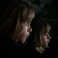two children intently watching something - concert stock pictures, royalty-free photos & images