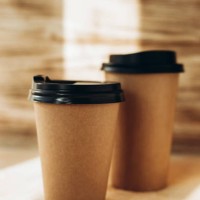 two craft hot drink cups with black lid on wooden background - junk food stock pictures, royalty-free photos & images