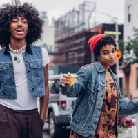 two friends eating pizza on the street - fashion stock pictures, royalty-free photos & images