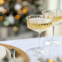 two glasses of champagne on christmas table - home decoration stock pictures, royalty-free photos & images