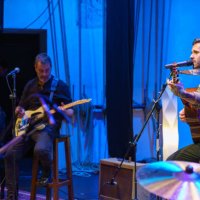 two guitarists and singer playing on stage - concert stock pictures, royalty-free photos & images