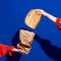 two hands with loaf of bread - food stock pictures, royalty-free photos & images