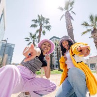 two hip friends with colorful outfits portrait in los angeles downtown - fashion stock pictures, royalty-free photos & images