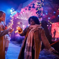 two joyful girlfriends dancing and waving sparklers during a new year's eve concert celebration - concert stock pictures, royalty-free photos & images