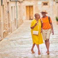 two mature women walking together - travel stock pictures, royalty-free photos & images