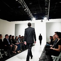 two models in business suits walking on catwalk - fashion stock pictures, royalty-free photos & images