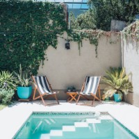 two sun chairs at swimming pool in patio - home decoration stock pictures, royalty-free photos & images