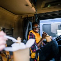 two truck drivers eating on lunch break - junk food stock pictures, royalty-free photos & images