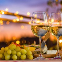 two white wine glasses on outdoors restaurant table - food stock pictures, royalty-free photos & images