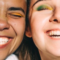 two young beautiful women with bright make-up close-up. diversity concept. - fashion stock pictures, royalty-free photos & images