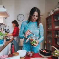 two young woman preparing fresh food for take away - junk food stock pictures, royalty-free photos & images