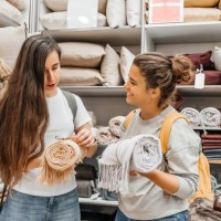 two young women on a shopping spree in a household store. - home decoration stock pictures, royalty-free photos & images